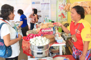 Jesusana explains to a customer how the taste of salted and duck eggs from Pateros differ from similar eggs in other places.
